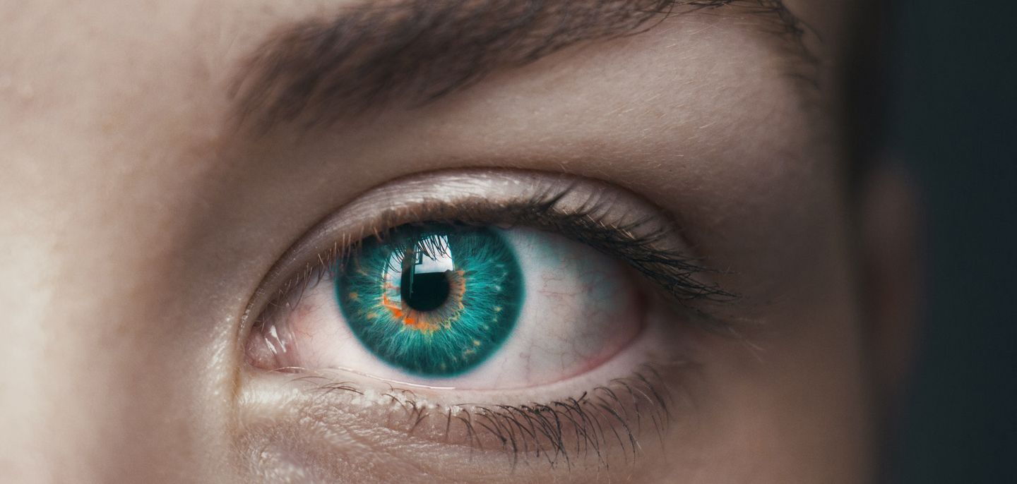 Close-up of an eye with a green iris
